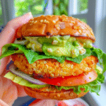 sweet potato quinoa burgers topped with creamy avocado ranch drizzle